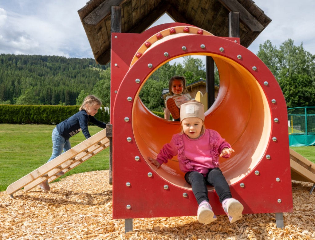 Child slides down the slide © Lorenz Masser Photography