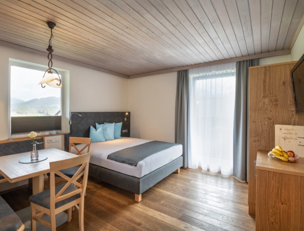 Living room with double bed © Lorenz Masser Photography