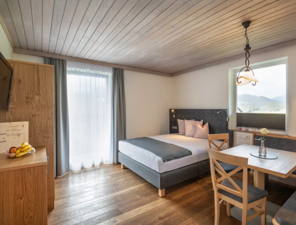 Double bed in the living room © Lorenz Masser Photography