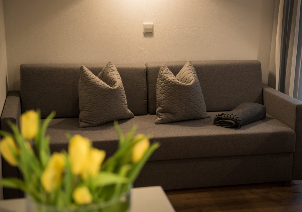 Comfortable couch in the room © Lorenz Masser Photography